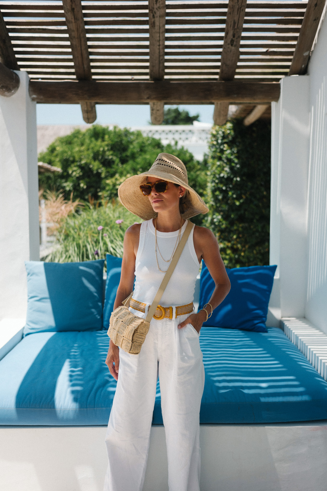 straw hat straw bag white tank white linen pants