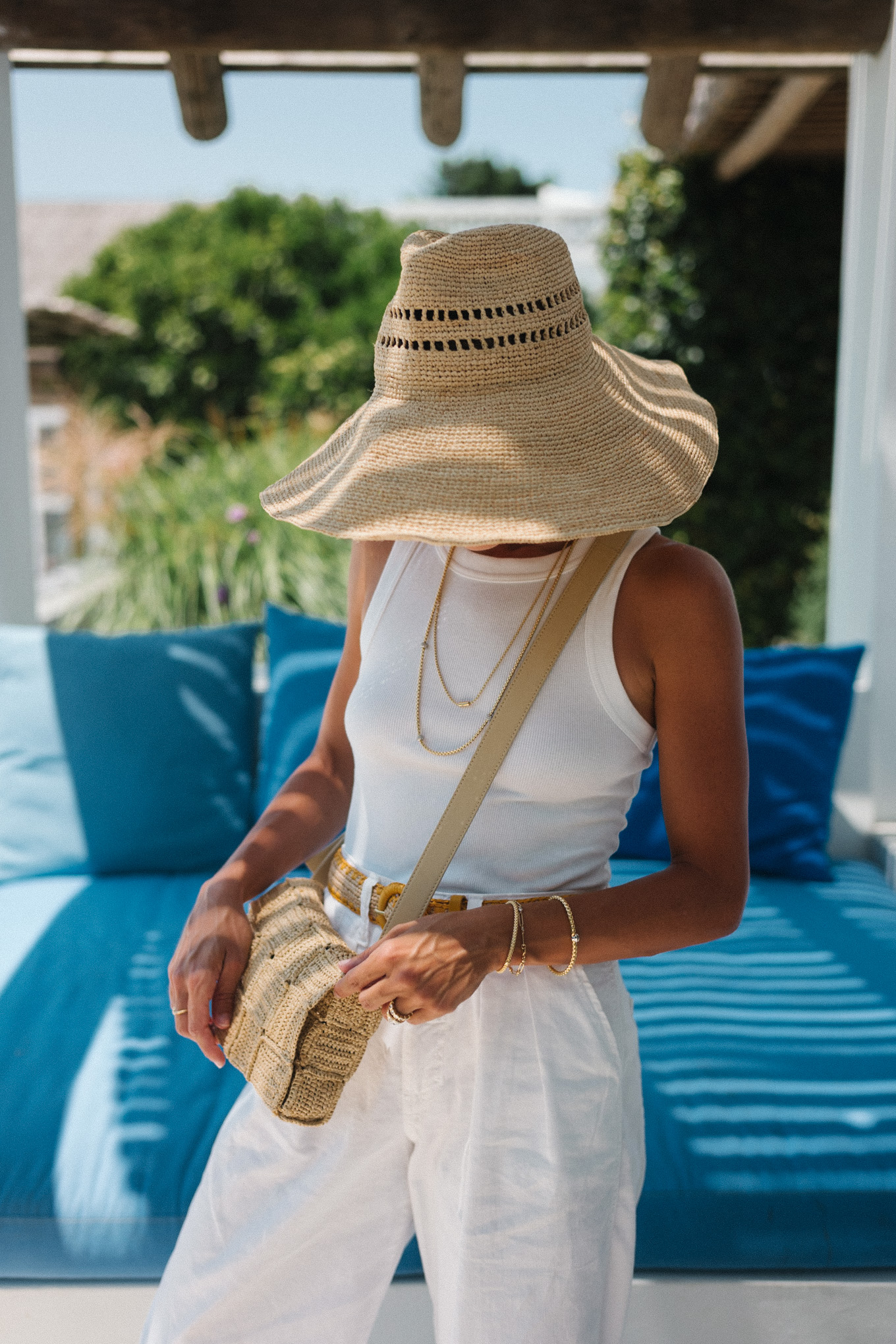 straw hat straw bag white tank white linen pants