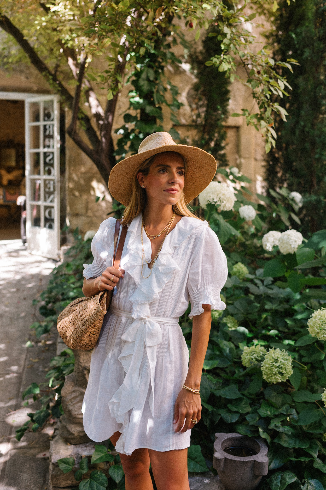 white belted ruffled minidress straw hat straw bag