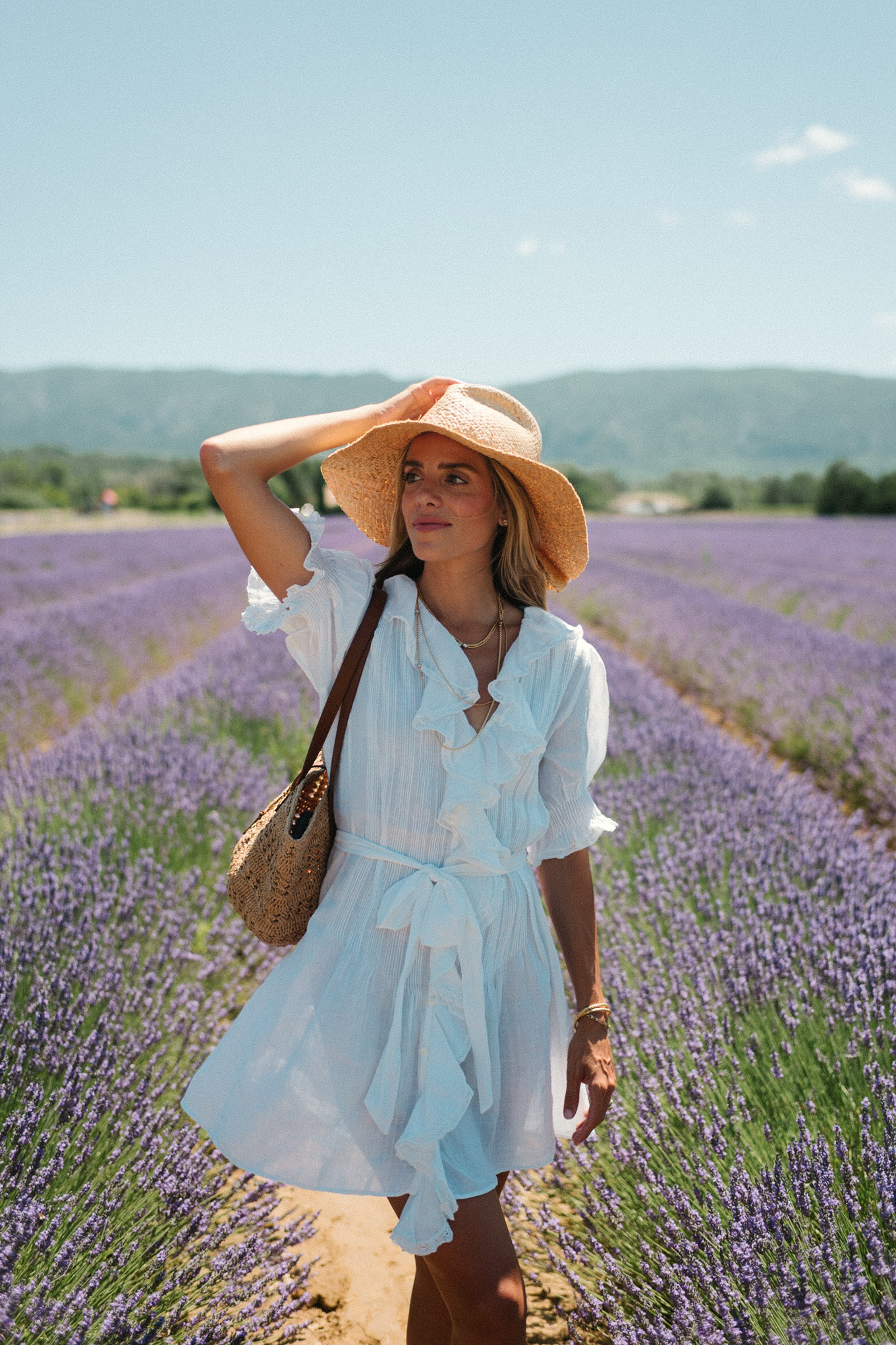 white belted ruffled minidress straw hat straw bag