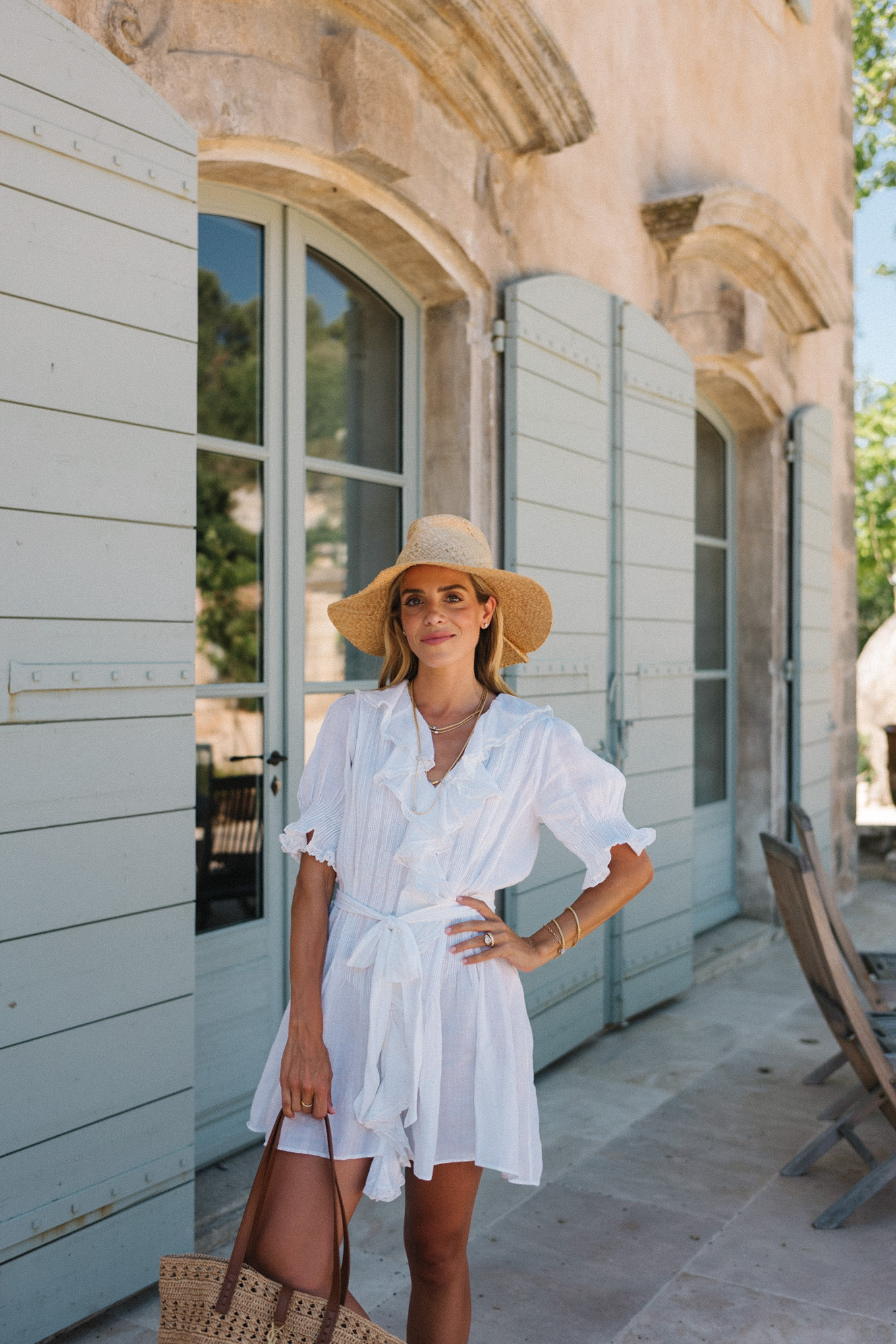 white belted ruffled minidress straw hat straw bag