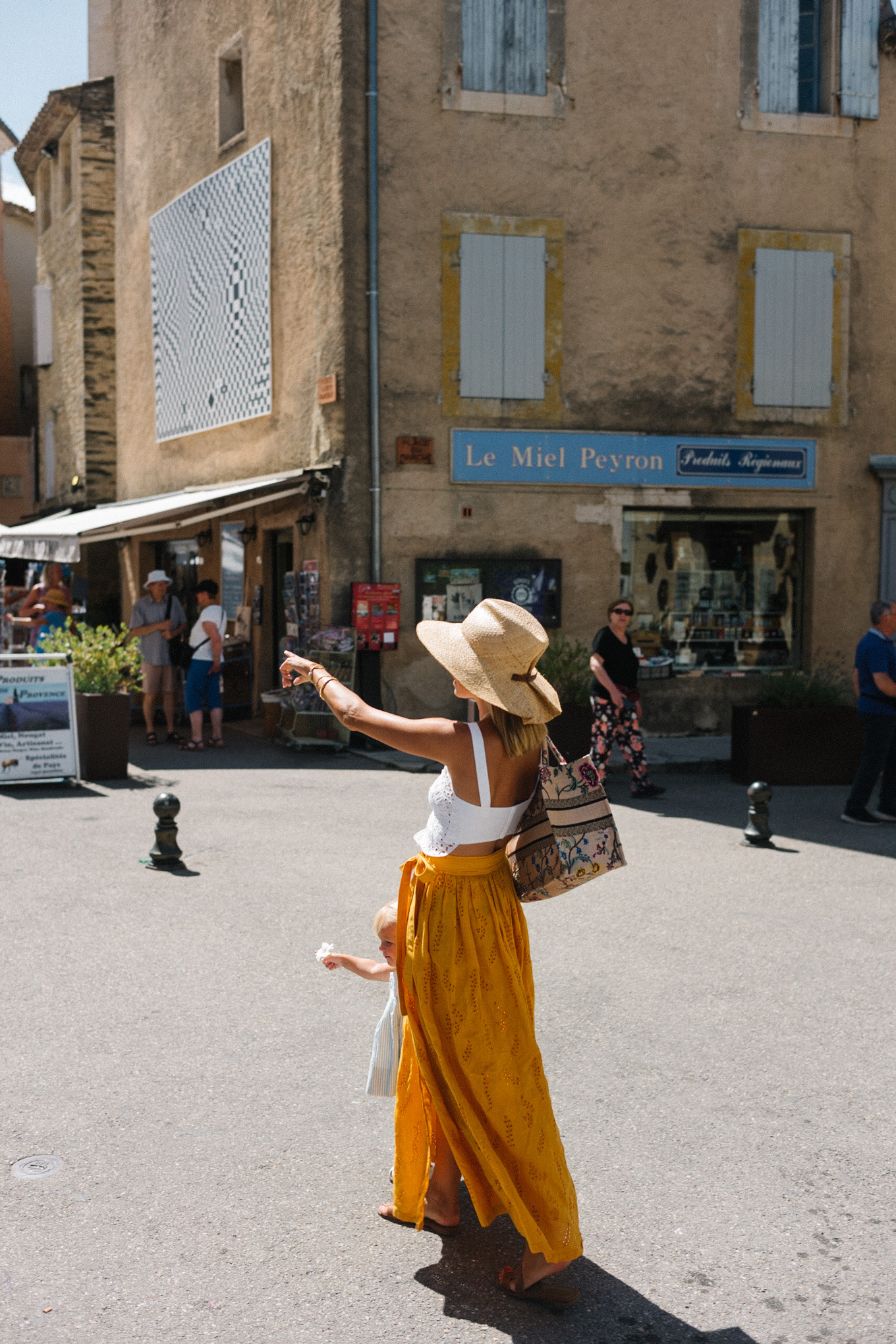 white eyelet top gold skirt straw hat