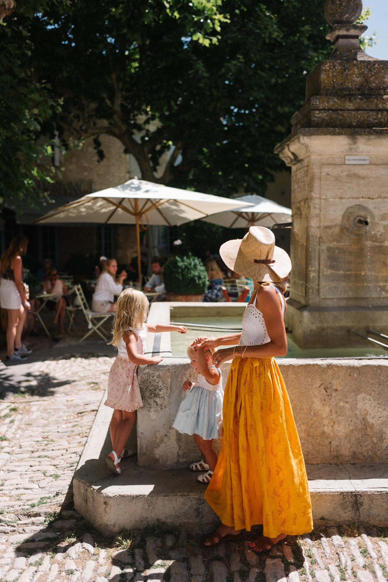 white eyelet top gold skirt straw hat