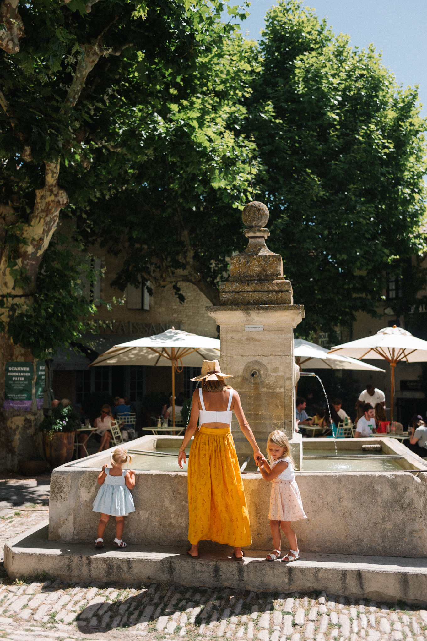 white eyelet top gold skirt straw hat