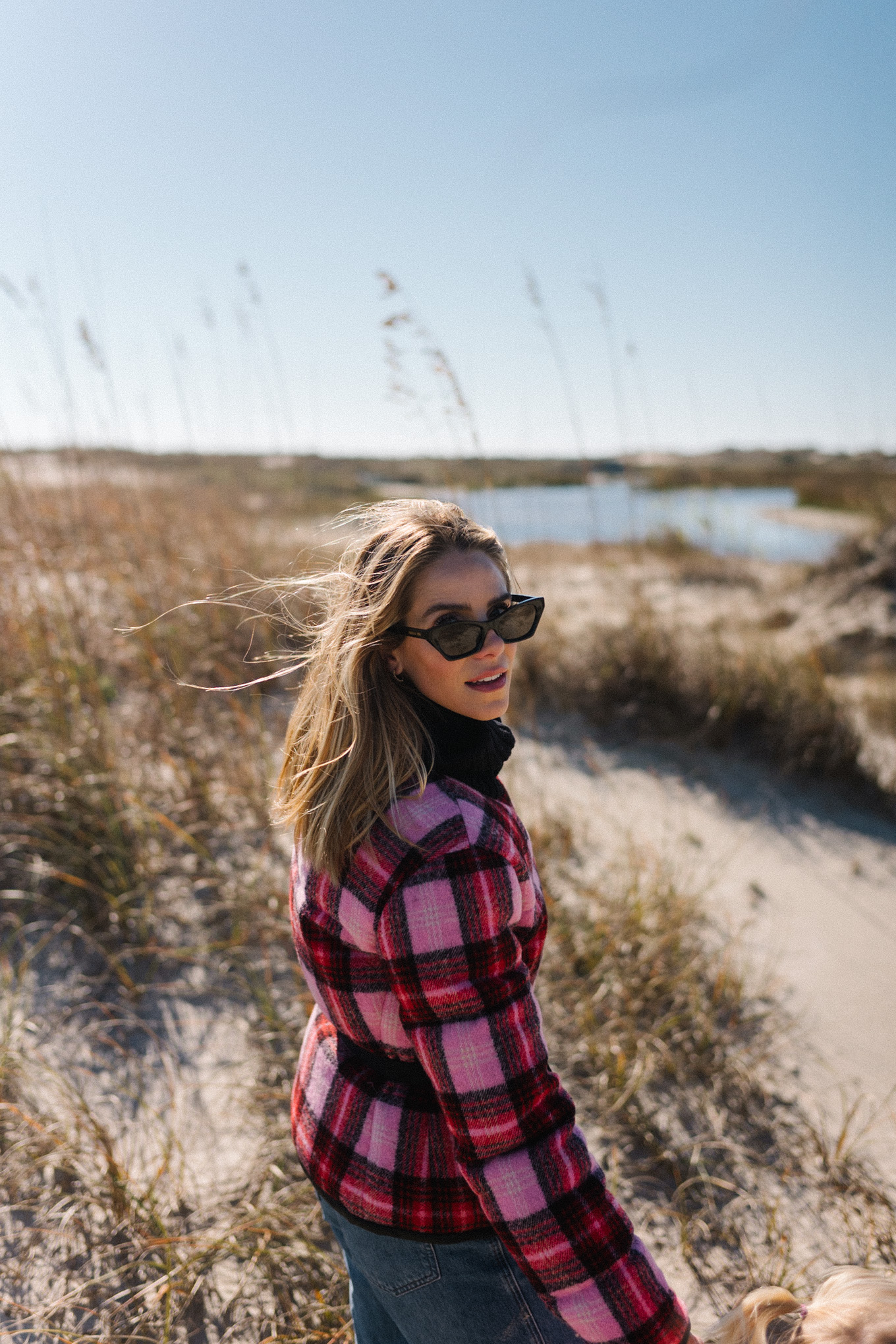 pink red plaid puffer coat blue jeans