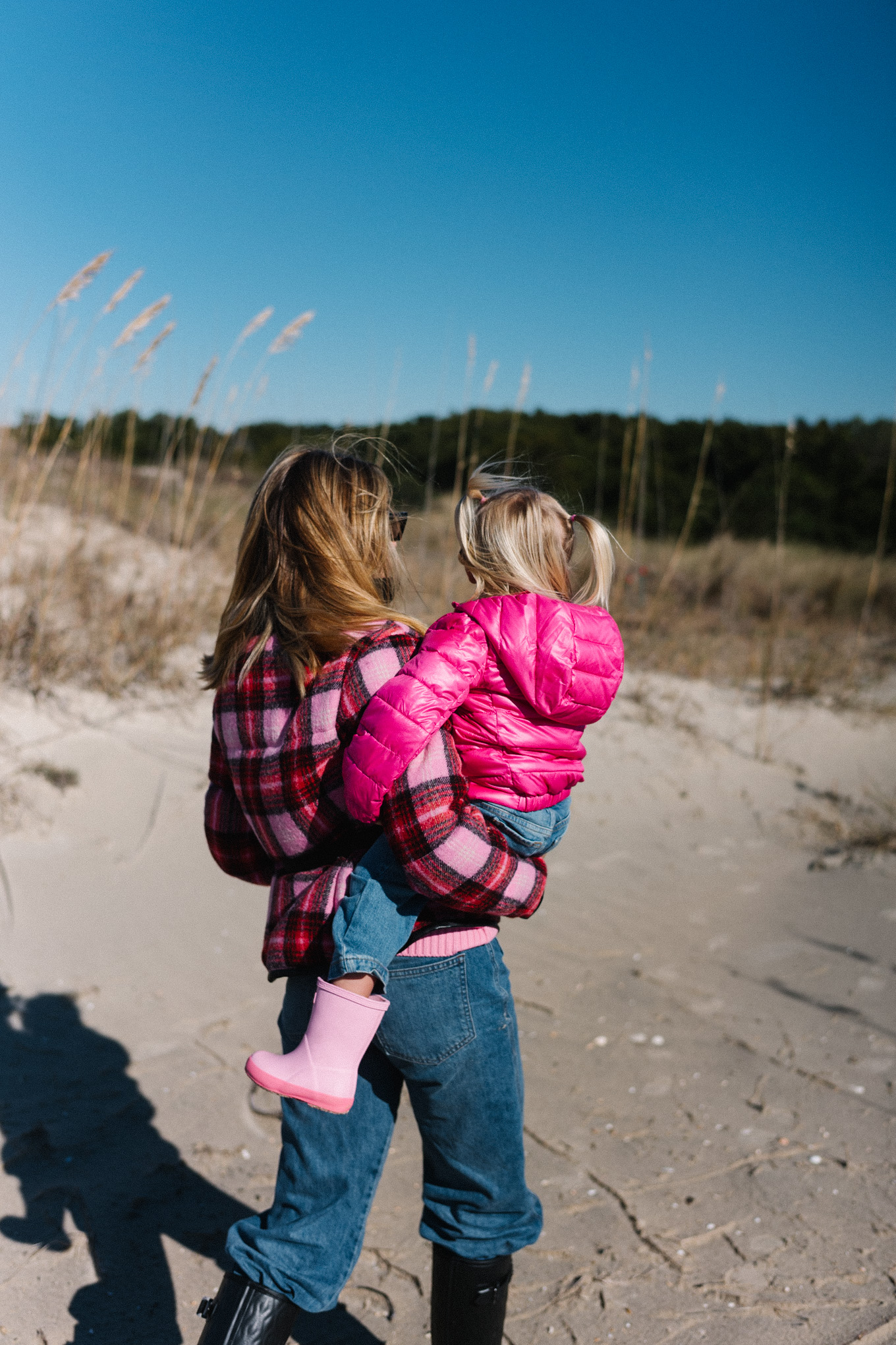 pink red plaid puffer coat blue jeans