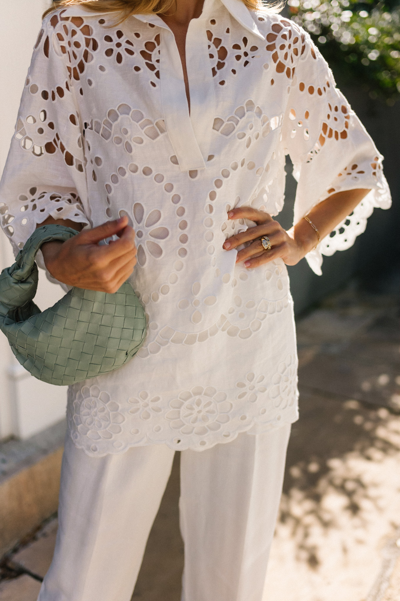 white eyelet blouse white pants seafoam green bag