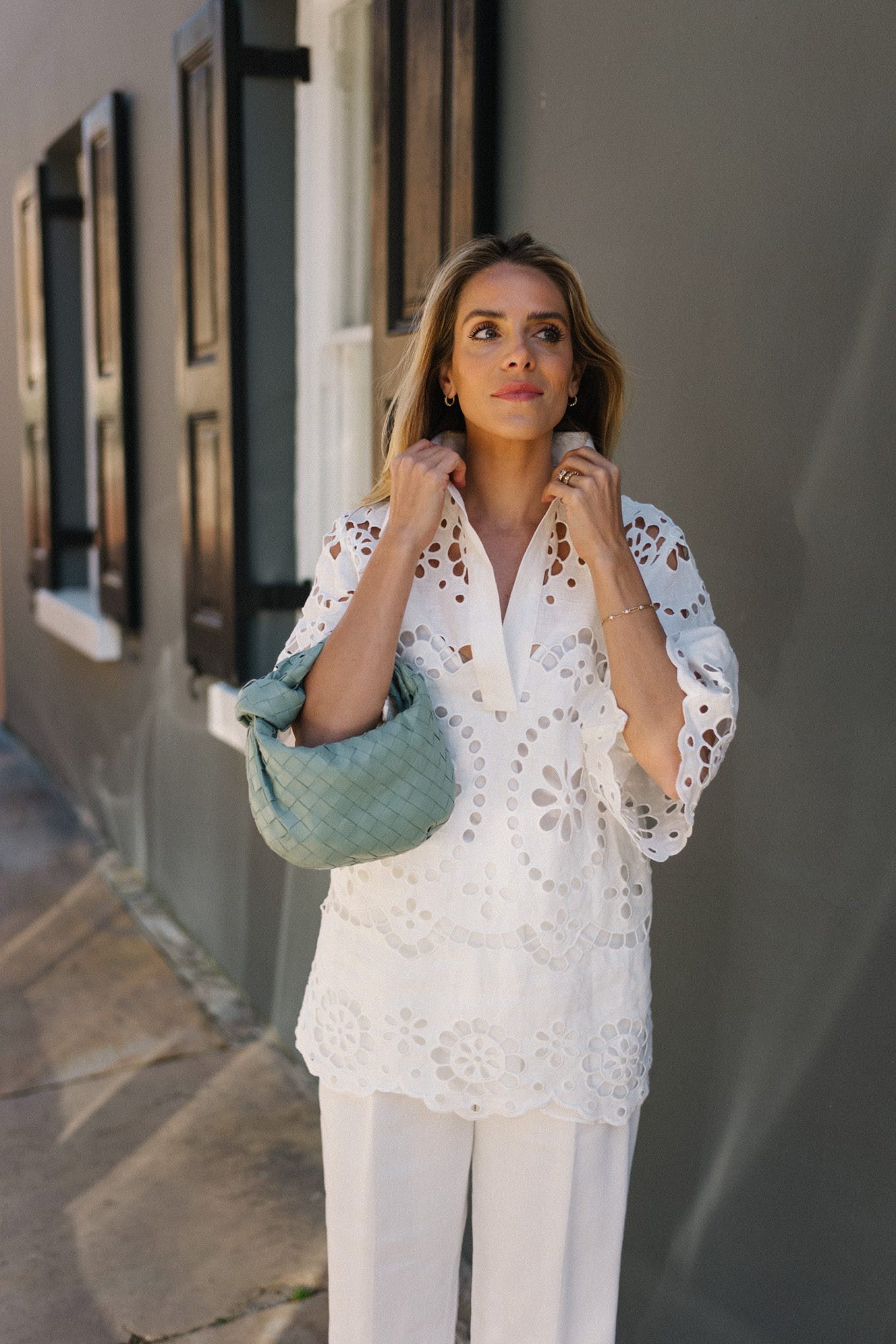 white eyelet blouse white pants seafoam green bag