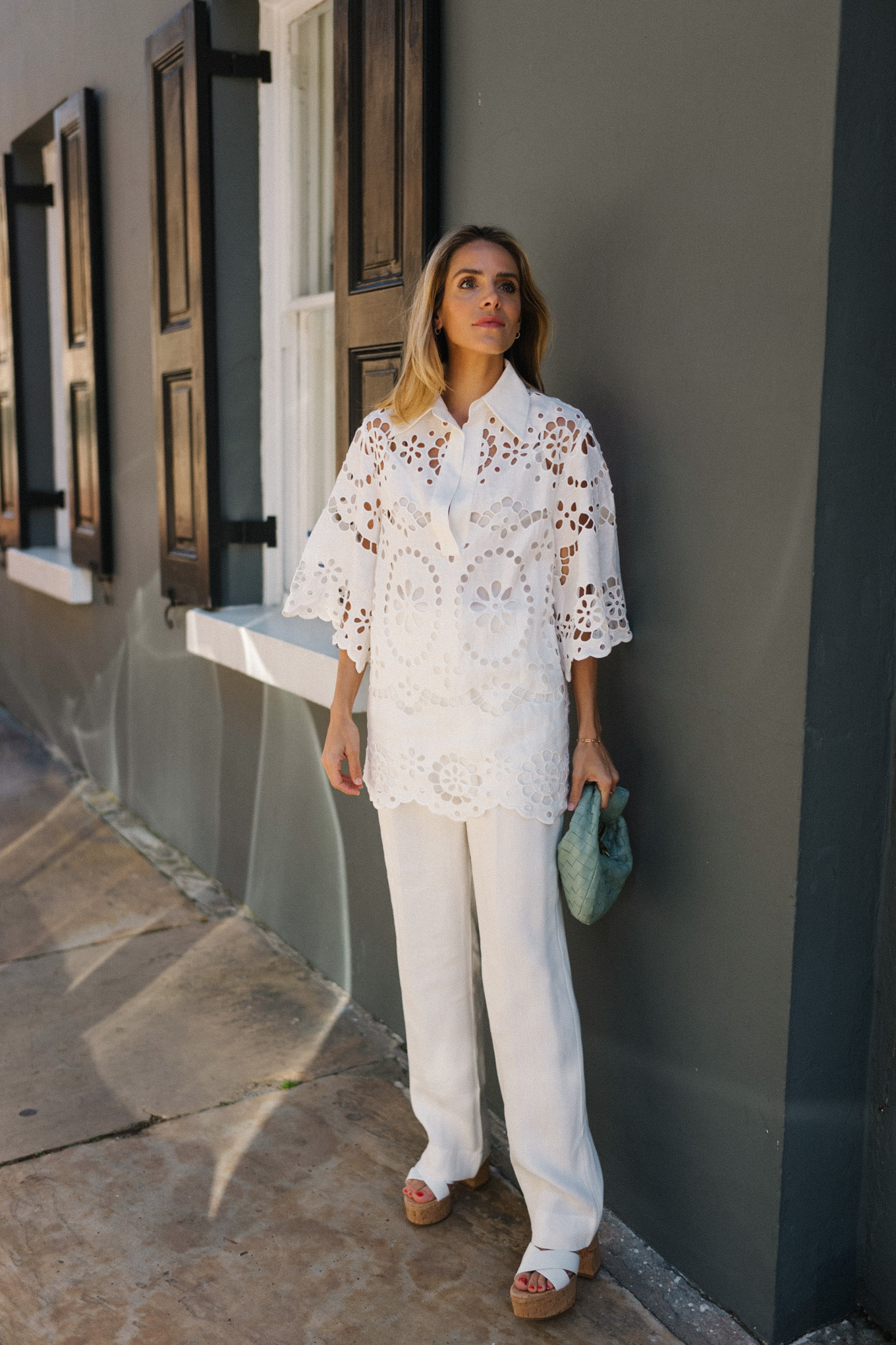 white eyelet blouse white pants seafoam green bag